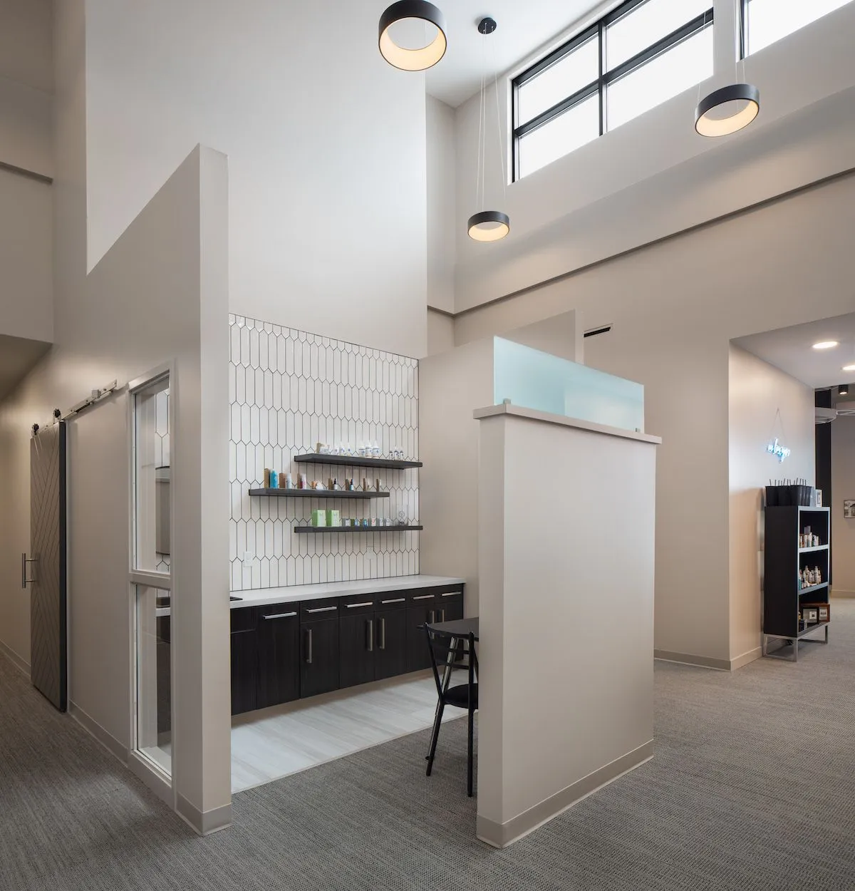 Contemporary interior of McCulley Optix Gallery featuring a modern optical exam and eyewear styling area with clean architectural design and natural lighting - mcculley optix gallery